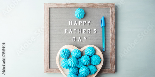 Happy fathers day greeting card with text on letter board