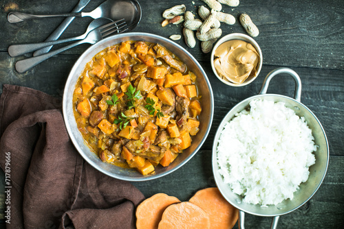 African chicken peanut stew with sweet potatoes  with side of basmati rice photo