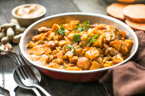 African chicken peanut stew with sweet potatoes  with side of basmati rice photo