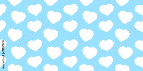 Heart shaped clouds. Pattern of white clouds in the shape of heart on blue sky background. Cartoon cloudy pattern. Seamless pattern with curly clouds.