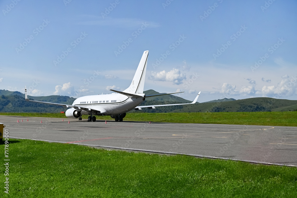 large passenger plane was taxiing for take-off in summer large passenger plane was taxiing for take-off in summer