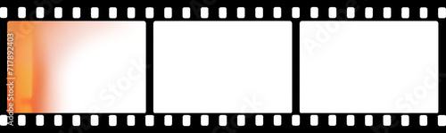 35 mm filmstrip with three frames with red glare and transparent  background (PNG image) for banners, mockups, designs, retro film effects, and light leaks etc. photo