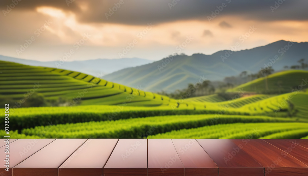 Fototapeta premium Empty mahogany table top counter against blurred tea plantation background. Blank flat display case on blur highlands landscape. Tea product presentation desk. Modern backdrop, stage, pedestal. Banner