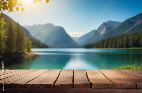 Empty wooden tabletop with blur background of summer lakes mountain. Perspective wood display on lake view. Beautiful rock glacier fresh landscape scenery, plank table blank board for product montage