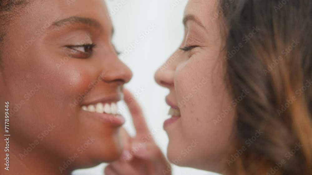 Close up portrait of Black woman and partner in gentle gesture of affection Close up portrait of Black woman and partner in gentle gesture of affection