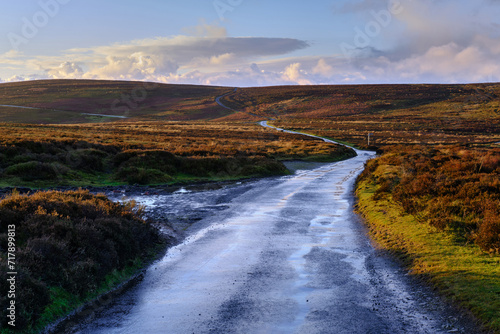 Fotografie Lonely road across moorland in the UK