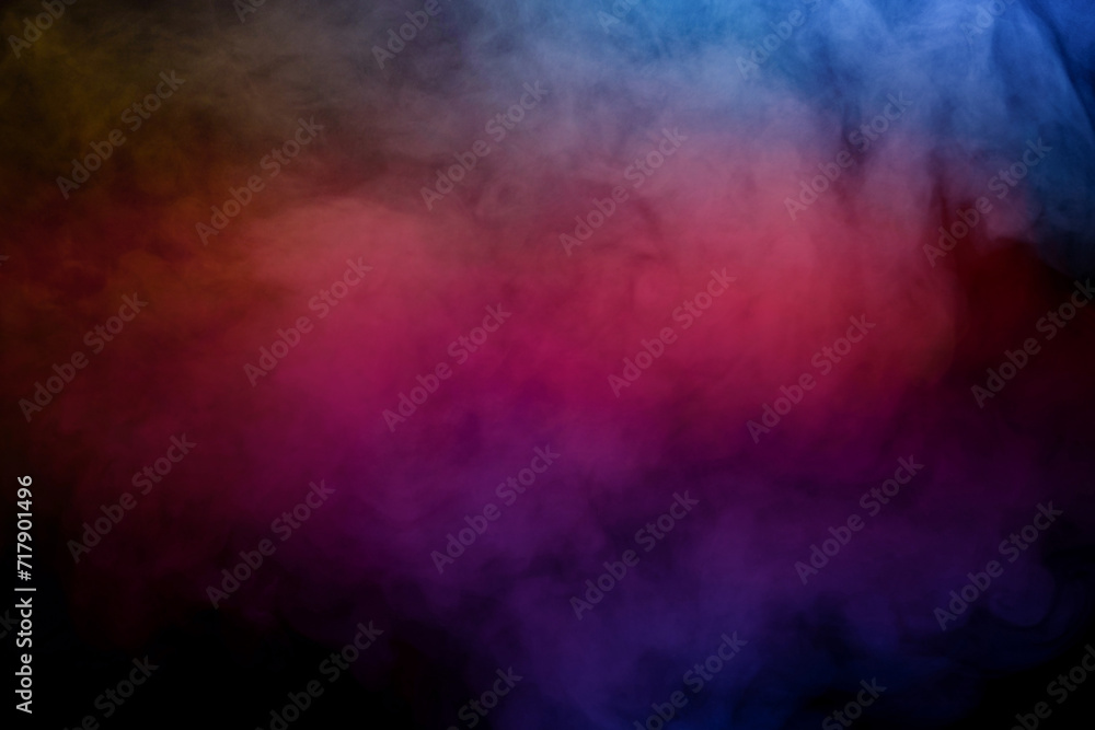 Fototapeta premium Blue and yellow steam on a black background.