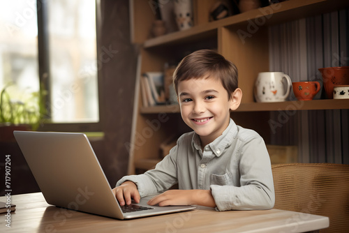 Boy doing homework on a laptop
