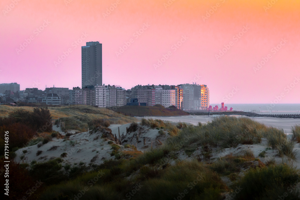 sunrise over the city in the dunes