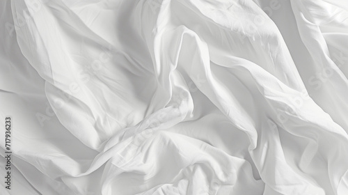 white silk background of a wrinkled white sheet or fabric