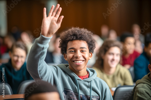 Happy black student raising hand to ask questions during class