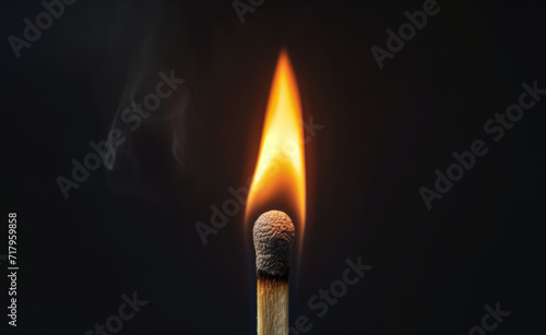Burning flames on a match close-up on a black background