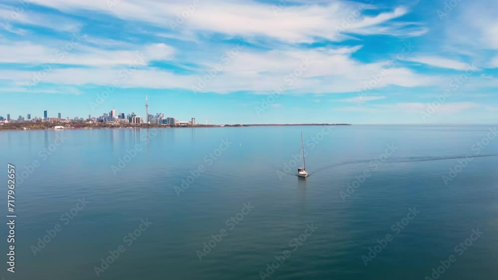 yacht gracefully floats lake against urban landscape, epitomizing sheer luxury. Yacht's luxury, juxtaposed cityscape, creates strikingly elegant luxurious ambiance. opulent epitome lakeside Drone view yacht gracefully floats lake against urban landscape, epitomizing sheer luxury. Yacht's luxury, juxtaposed cityscape, creates strikingly elegant luxurious ambiance. opulent epitome lakeside Drone view