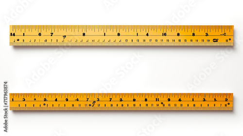School rulers in inches and centimeters set apart on a white background photo