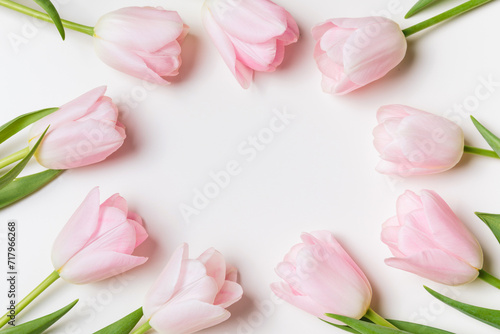 Fototapeta Naklejka Na Ścianę i Meble -  Light pink blooming tulips flowers row over white background. Spring holiday banner, frame, border, happy easter card, mothers day, international womans day. Flat lay, top view, copy space