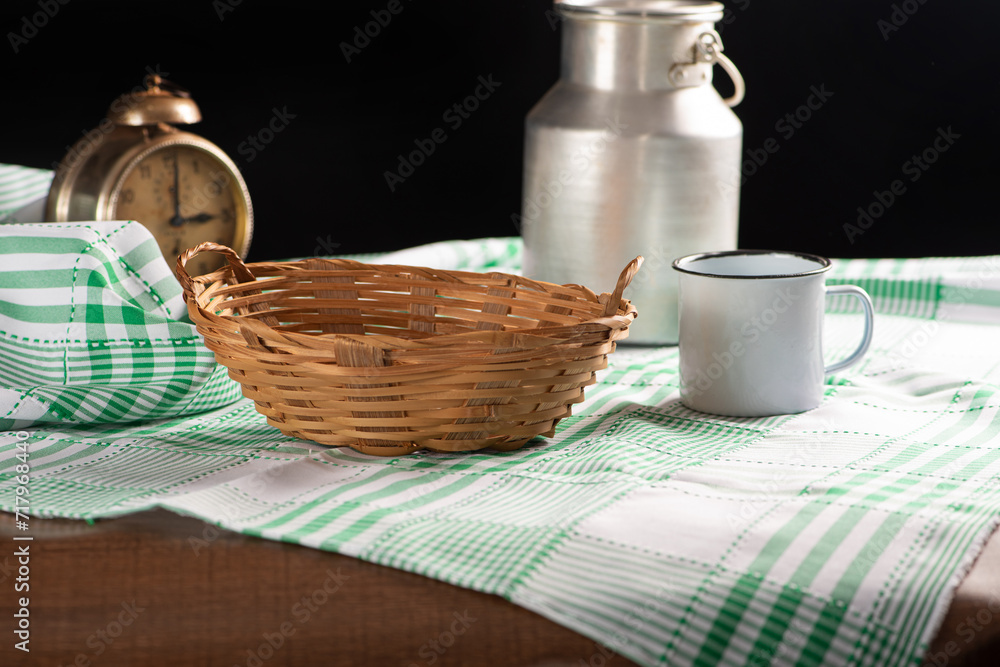 Straw basket, beautiful straw basket and accessories on wooden table and tablecloth, selective focus. Straw basket, beautiful straw basket and accessories on wooden table and tablecloth, selective focus.