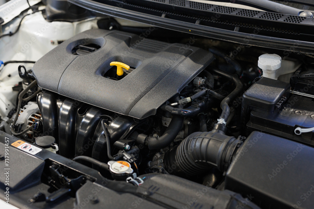 Engine or motor close-up. An open hood, engine repair and cleaning in an auto repair shop.