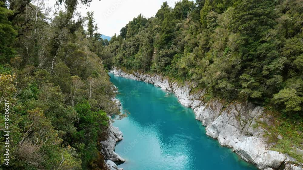 Captivating view of Hokitika Gorge from a picturesque bridge, showcasing turquoise waters and stunning natural beauty. Captivating view of Hokitika Gorge from a picturesque bridge, showcasing turquoise waters and stunning natural beauty.