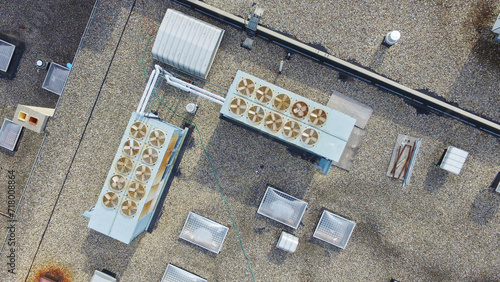 Aerial View of Commercial HVAC Units and Ventilation Equipment on Gravel Rooftop