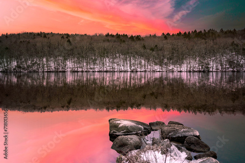 The vibrant winter landscape of Webb Mountain and water reflection on Lake Zoar in Monroe, Connecticut, tranquil scenery of New England of America photo