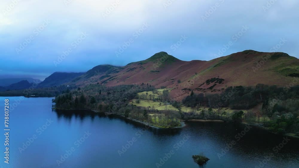 Lake District Keswick Derentwater England. Drone flies over lake with Lakeland Mountains in view. Scenic Cinematic. Lake District Keswick Derentwater England. Drone flies over lake with Lakeland Mountains in view. Scenic Cinematic.