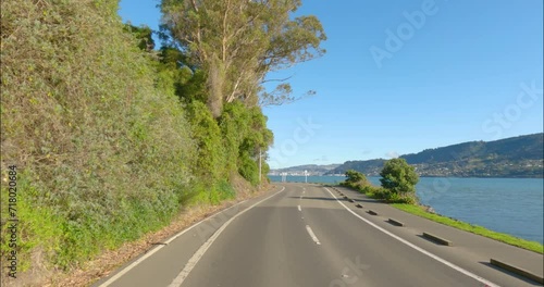 Dunedin, New Zealand - A Scenic Drive Along a Lakeside Highway en Route to the Hilly Landscapes of Otago Peninsula - POV