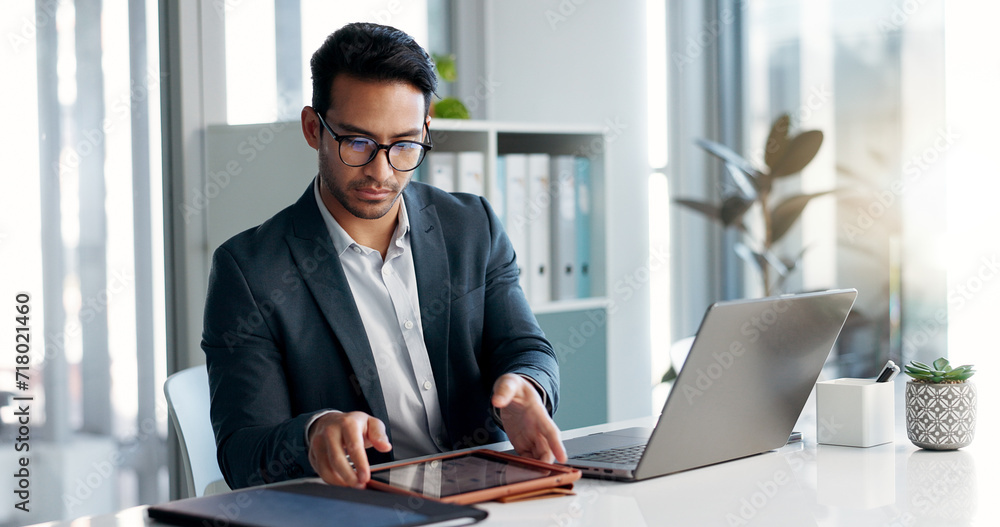 Obraz premium Business man, laptop and tablet for data analytics, stock market and online research for profit, sales or company account. Asian trader, investor or analyst in office on digital tech and computer
