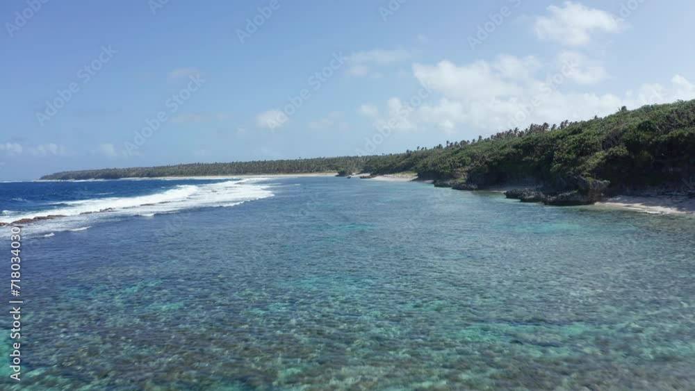 Aerial View of Coral Reefs and Ocean Waves by Coastline of Tonga, Polynesia Aerial View of Coral Reefs and Ocean Waves by Coastline of Tonga, Polynesia