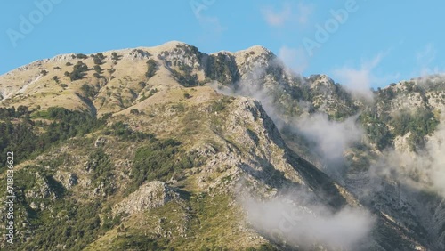 Majestic Cuka Partizan mountain range foothill during blue sky day, Albania photo