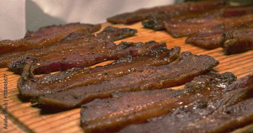 Beef strips placed under heater at Brazilian restaurant Beef strips placed under heater at Brazilian restaurant