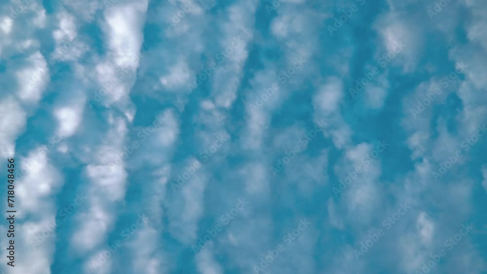 A beautiful time lapse from below, surfing white clouds, blue sky, daylight sun, 4k static video A beautiful time lapse from below, surfing white clouds, blue sky, daylight sun, 4k static video