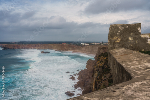 Stunning windswept cliffs, Atlantic ocean, and cloudy sky.  View from Sagres lighthouse, Portugal