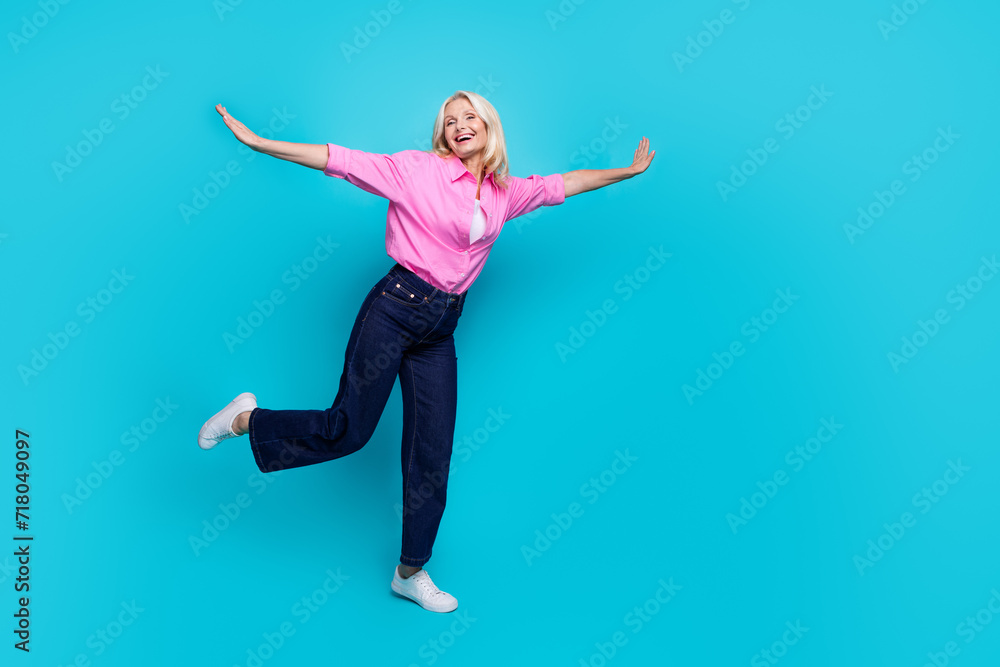 Full length photo of senior lady hands wings fly dancing wear trendy smart casual garment isolated on cyan color background
