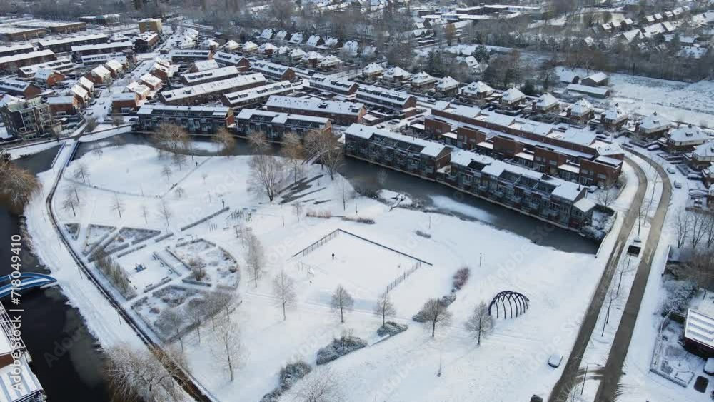 Beautiful aerial of a snow covered park in the middle of a suburban neighborhood in the Netherlands Beautiful aerial of a snow covered park in the middle of a suburban neighborhood in the Netherlands