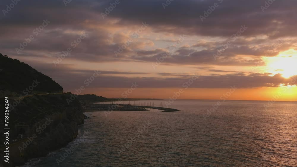 Dramatic view of road and Ginesta port in Costa del Garraf at sunrise Dramatic view of road and Ginesta port in Costa del Garraf at sunrise