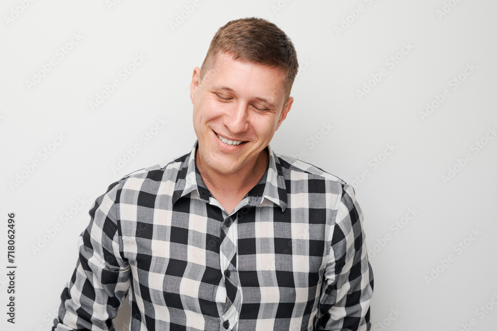 Portrait man smiling joyfully with happy face isolated on white studio background, advertising banner. Portrait man smiling joyfully with happy face isolated on white studio background, advertising banner.
