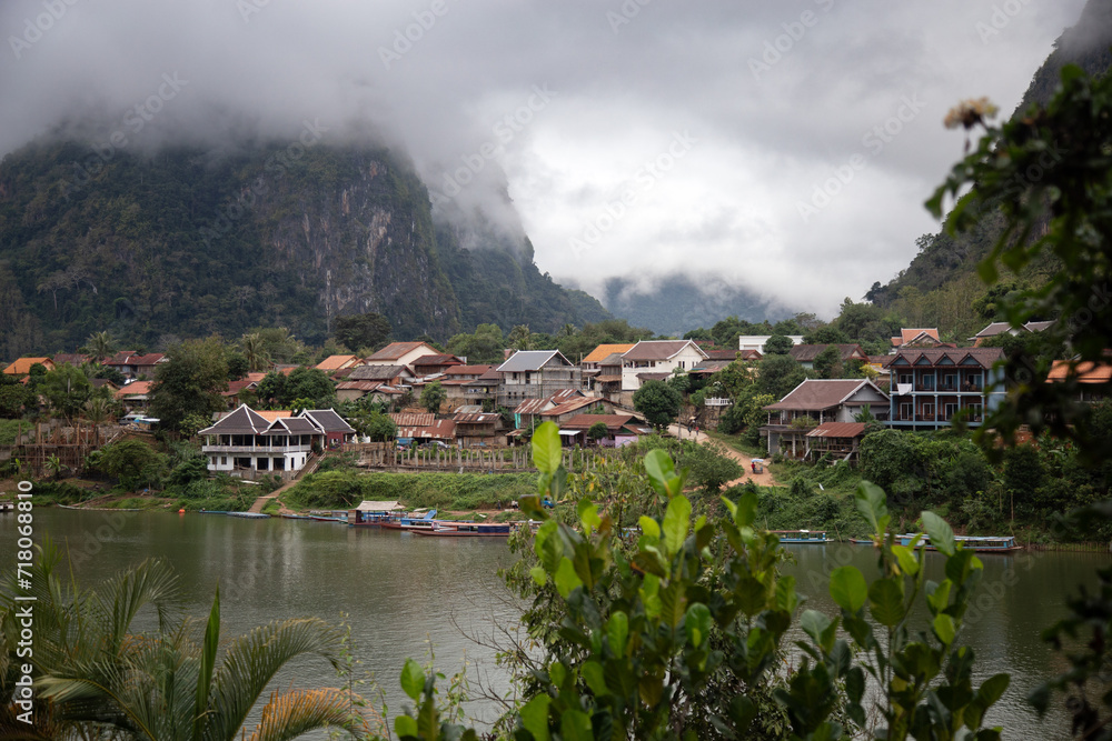 View from across the river of Nong Khiaw during rainy day