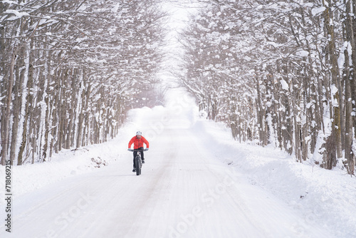 Fat biker riding his bicycle in the snow during Canadian winter
