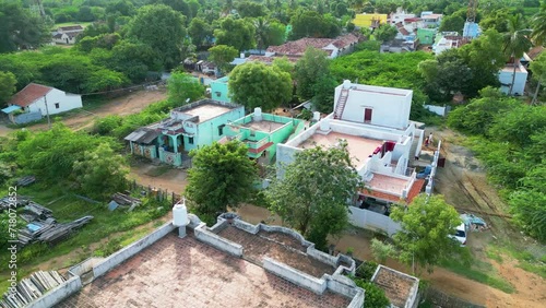 Lush, rural village near Karaikudi with traditional houses and greenery, aerial view. Tamil Nadu, India photo
