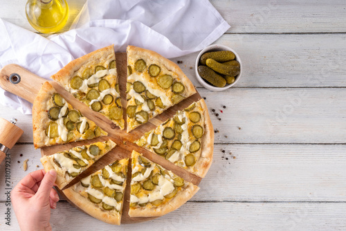 Obraz na plátně Pickle Pizza with cheese sauce and pickled cucumbers