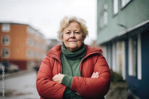 Elderly woman smiling in winter clothing outdoors