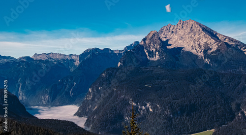 Alpine summer view with Lake Koenigssee under fog and Mount Watzmann seen from the famous Kehlsteinhaus, Eagle´s Nest, Berchtesgaden, Bavaria, Germany