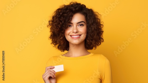 Happy and cheerful person holding credit card for shopping concept, photo on isolated color background, copy space for text