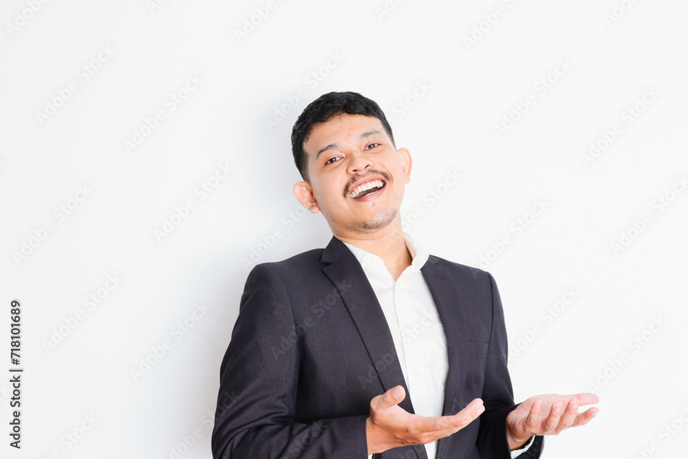 a young asian businessman stands and shows a gesture of pride and success a young asian businessman stands and shows a gesture of pride and success