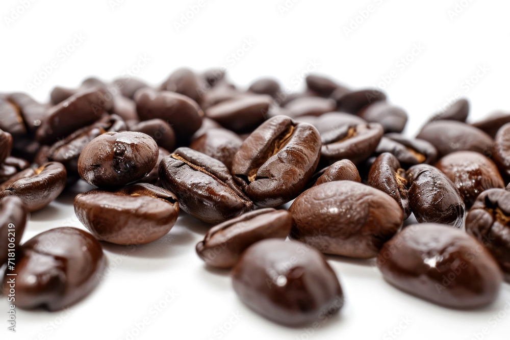 A pile of coffee beans on a white surface. A pile of coffee beans on a white surface.