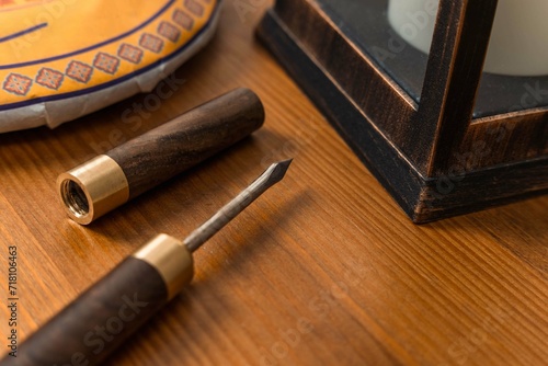 There is a special awl on the wooden table for cutting pressed Chinese tea. Tea knife 
