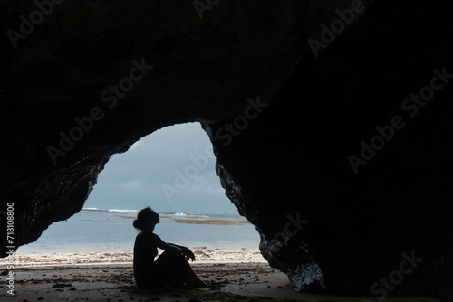 Wallpaper Mural Outline of a girl posing against the backdrop of the ocean among the rocks Torontodigital.ca