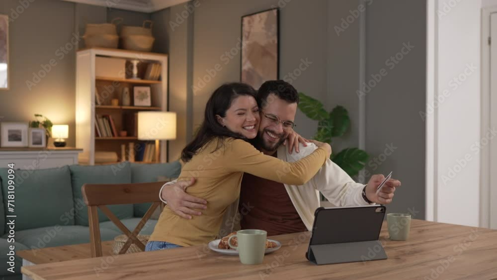 adult happy couple man and woman shopping online hold credit card adult happy couple man and woman shopping online hold credit card
