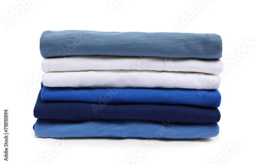 Stack of clean baby clothes isolated on white