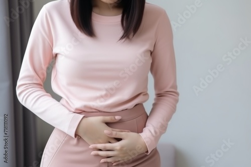 Mother expecting woman holding hand on belly touching pregnancy baby child birth health care life body care healthy pain female gynaecology wellbeing tummy standing gynecologist anticipation mom adult